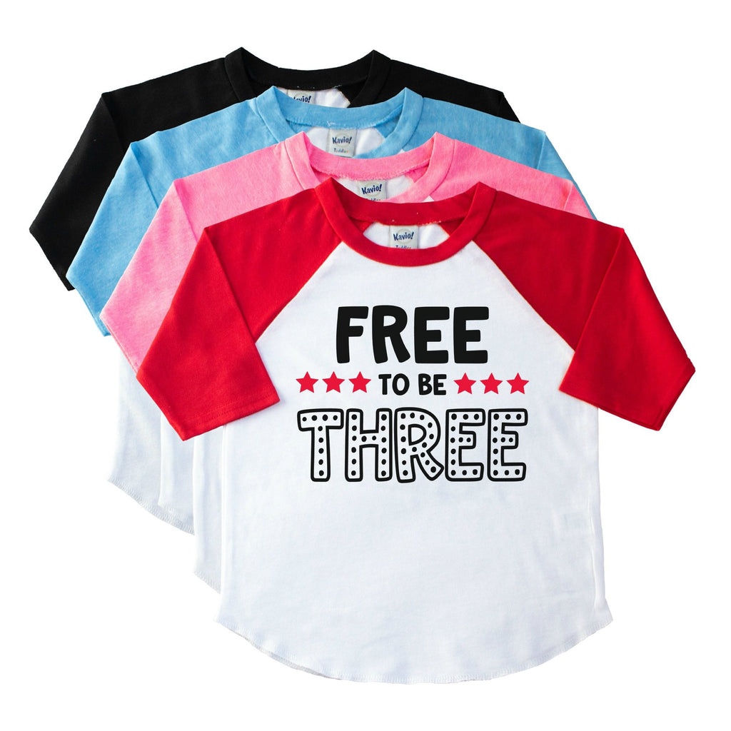 Toddler red sleeve raglan tee with Free to Be Three in black with red stars on the front