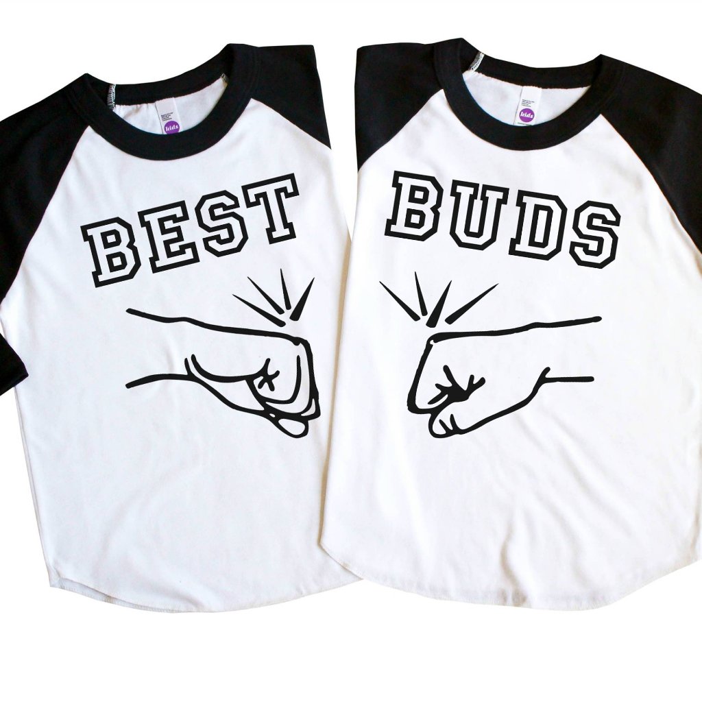 Two black sleeve raglan tees with Best Buds and fists bumping in black