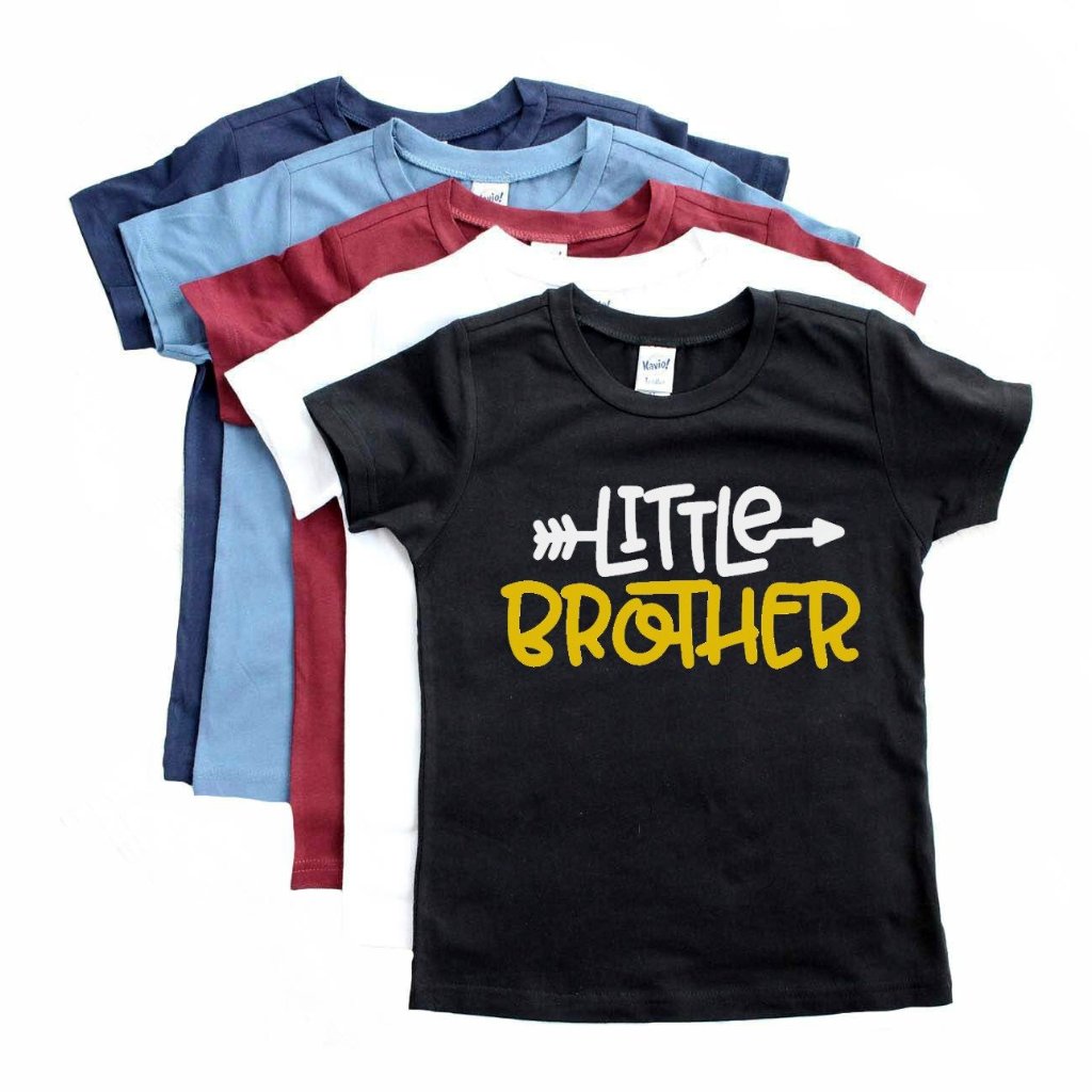 Array of colored tee with black tee on top with Little Brother in White and Yellow