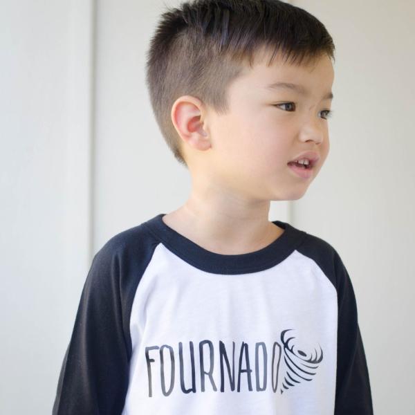 Little boy wearing black sleeve raglan with fournado in black
